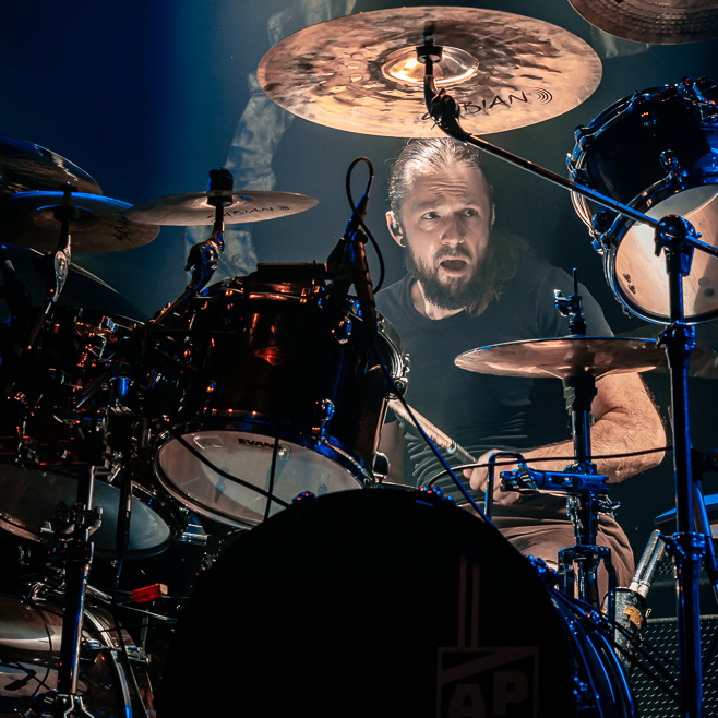 Ash playing drums
