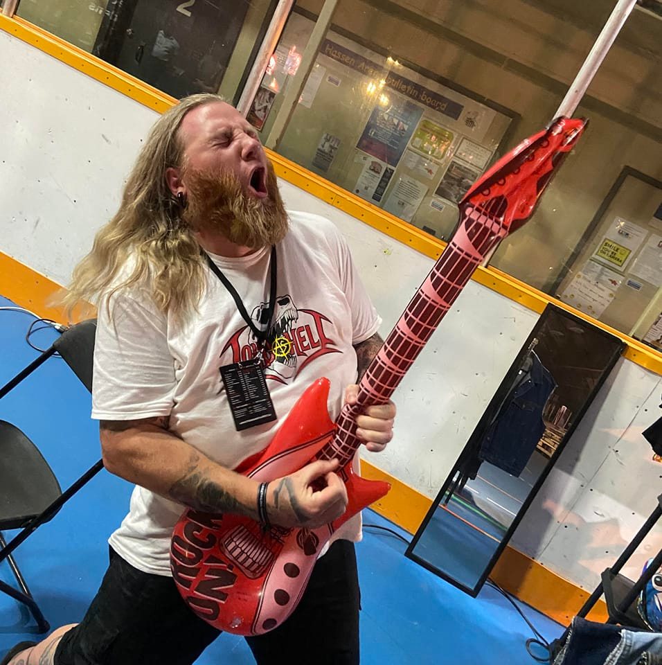 Geoff playing toy guitar